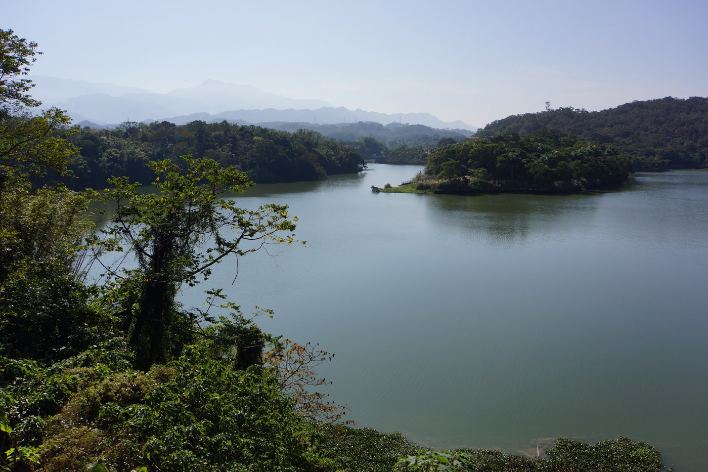 Calm Emei Lake waters and wooded islands in Hsinchu County (photographed in 2014)