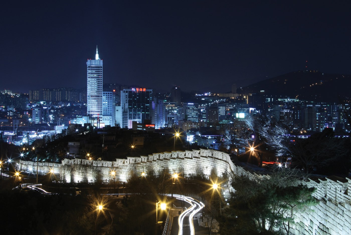 The illuminated Seoul City Wall winds through Naksan after dark (photographed in 2008)
