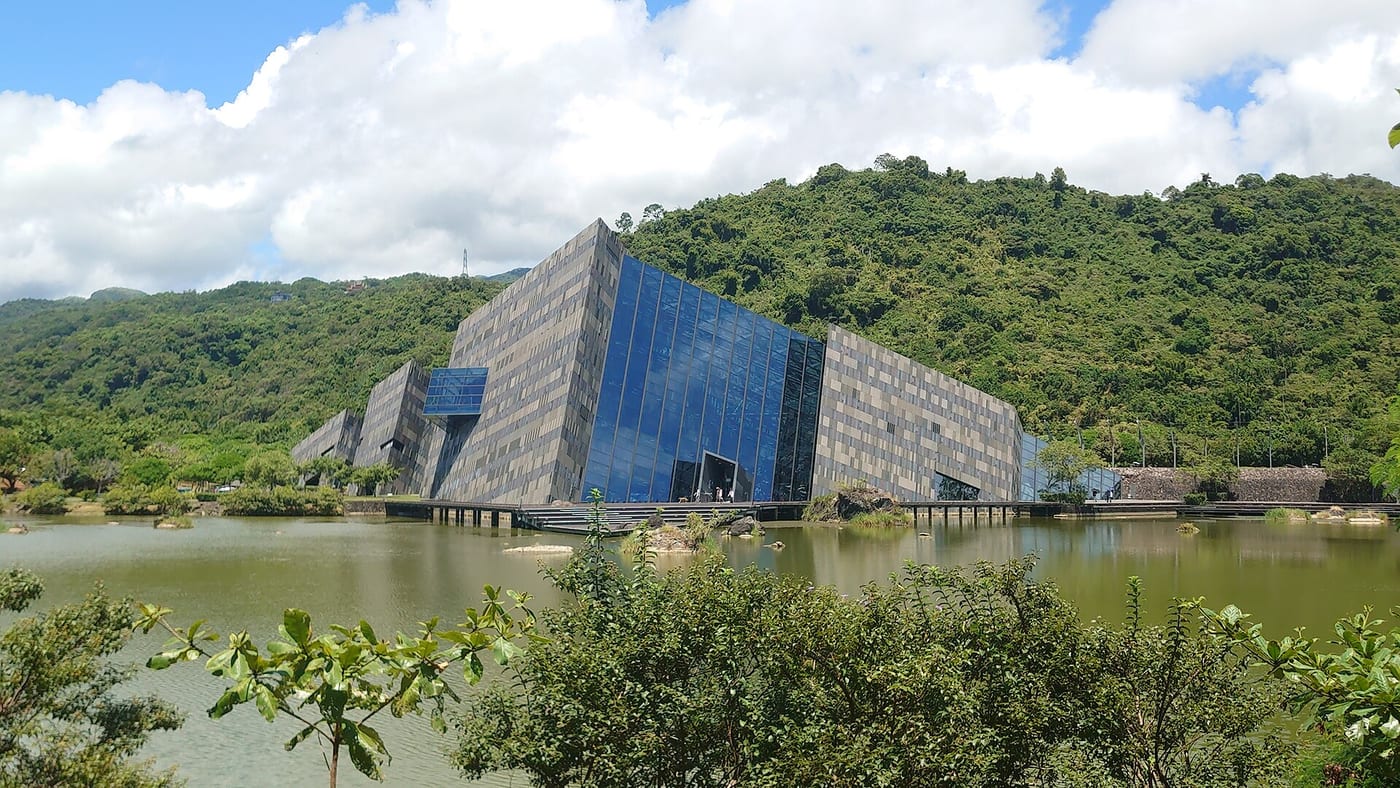 The angular Lanyang Museum building beside water and greenery
