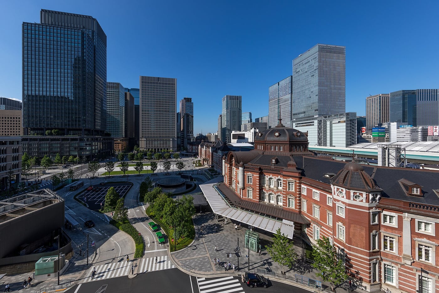 Tokyo Station's red brick Marunouchi building and plaza viewed from JP Tower