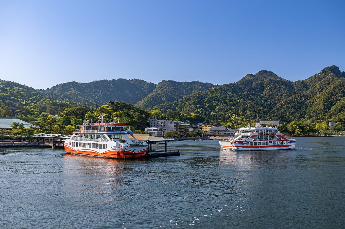 Ferries berthed at the piers of Miyajima Ferry Terminal