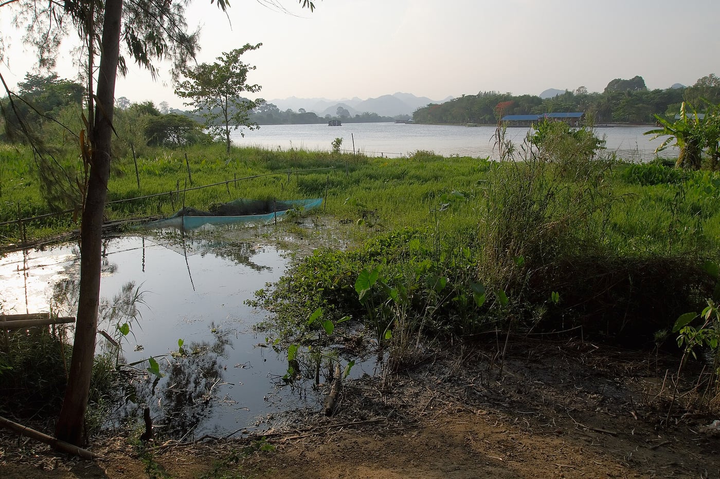 The bank and opposite riverside of the River Kwai in Kanchanaburi.