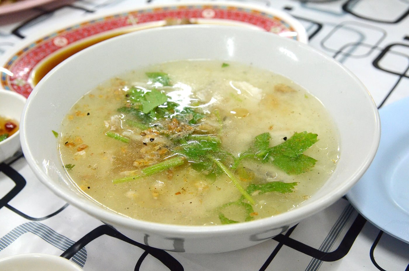 Breakfast dish reference: khao tom pla, Thai rice soup with fish.