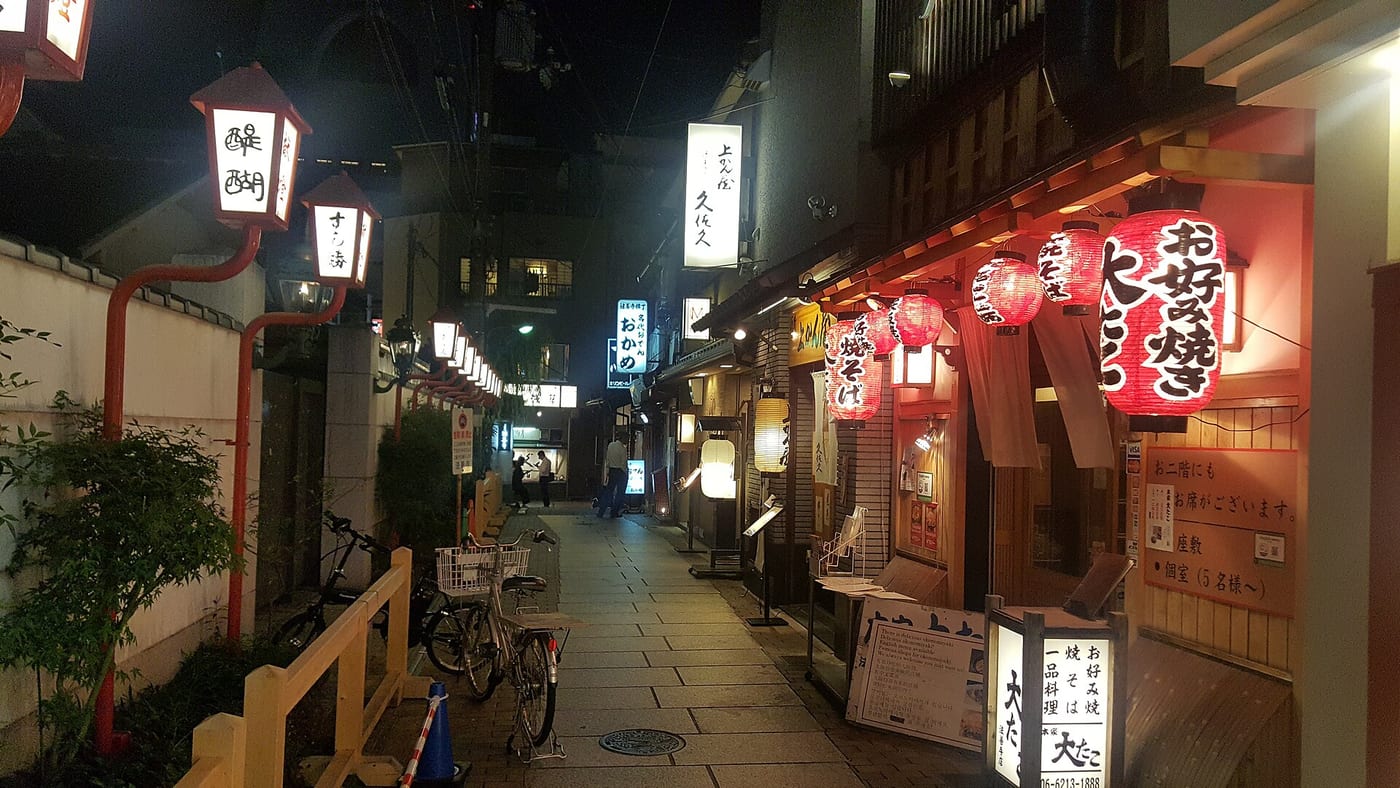 Lanterns and restaurant signs along the narrow lane of Hozenji Yokocho