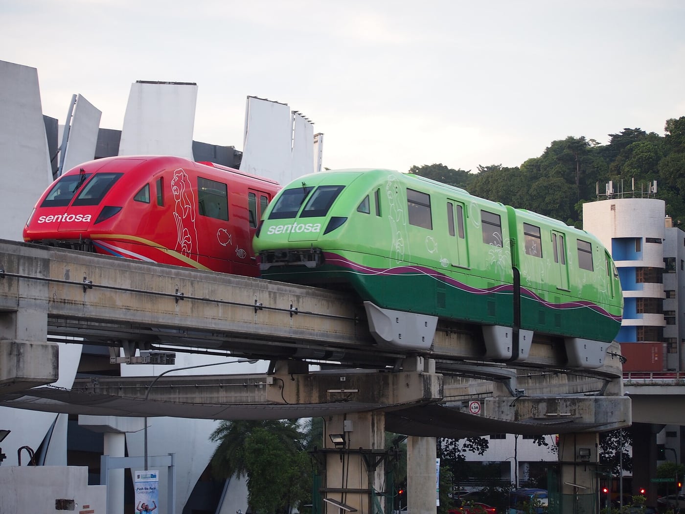 Red and green Sentosa Express trains (2013 photograph; train reference)