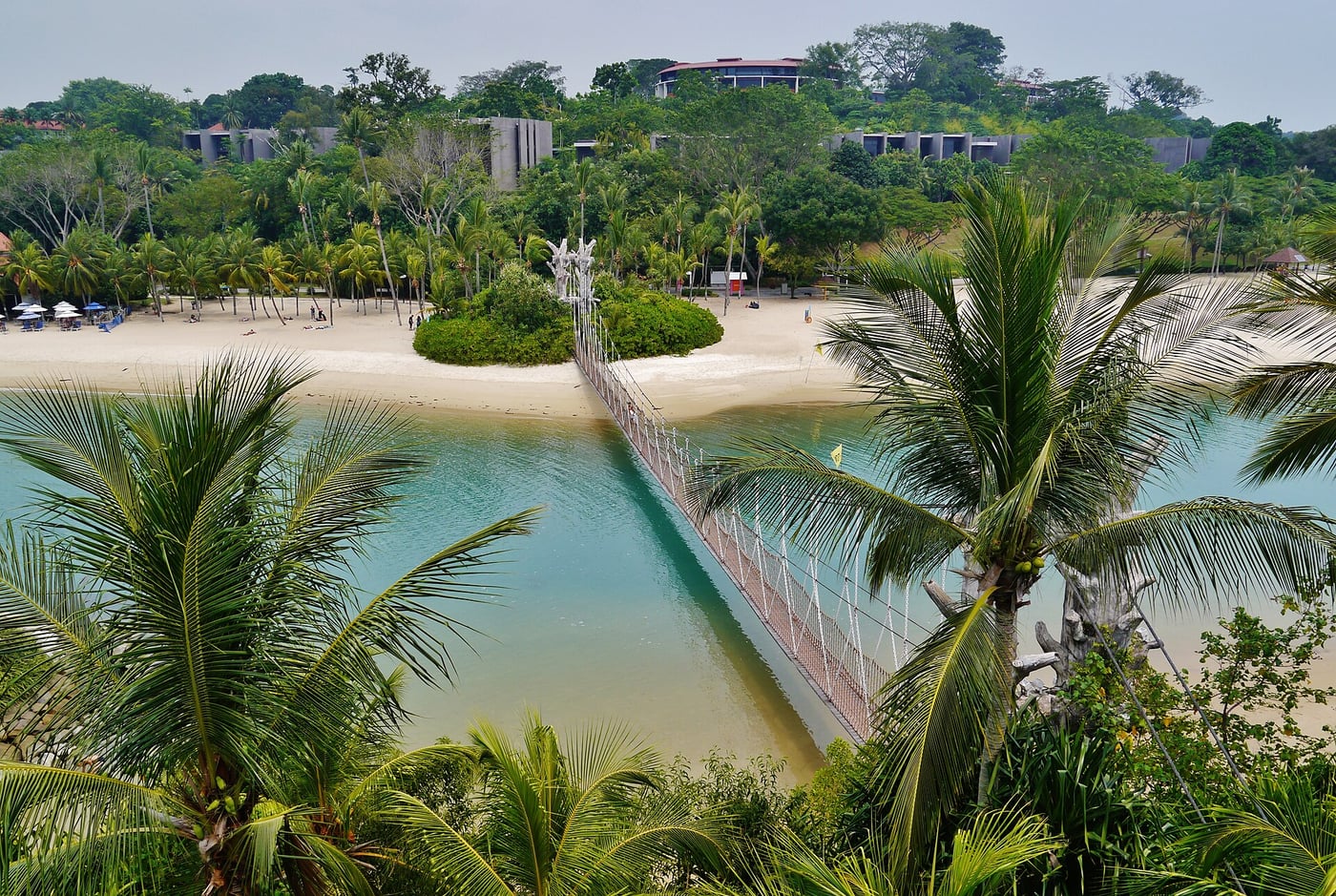 Palawan Beach suspension bridge and beach, viewed from the small island off Sentosa
